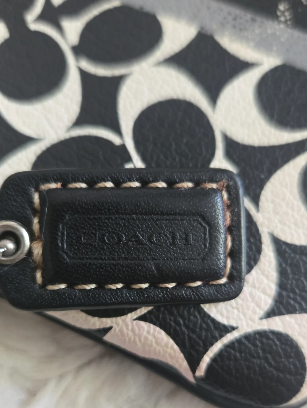Coach wristlet featuring
